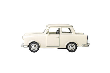 A white toy car trabant with chrome trim sits on a white background. The car is a classic model and he is a toy