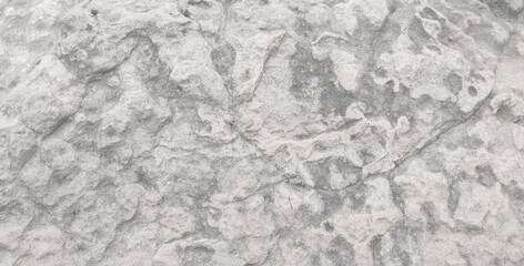 Empty grey grain stone wall on cave for abstract  background and texture. beautiful patterns, space for work, banner,seamless wallpaper, close up.