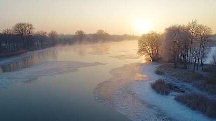 Frozen River at Sunset with Mist and Bare Trees