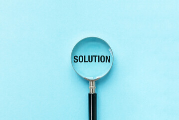 Magnifying glass with possible and Solution words on the blue background. Optimistic and Business metaphor concept.