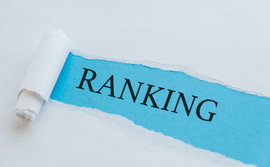 Ranking text on blue envelope and torn paper. Concept Image