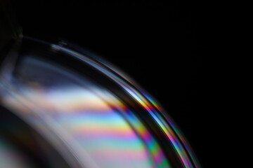 Bright rainbow reflection of liquid in macro, silver colors, surrealistic background, fantastic...