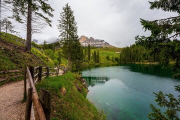 Cloudy sky over Lake Carezza in South Tyrol, Italy.