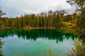 Cloudy sky over Lake Carezza in South Tyrol, Italy.