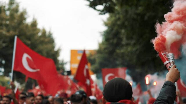 Colorful smoke bombs in action with Turkish fans waving flags, representing sports celebrations, social movements, protests, and dramatic visuals, emphasizing fandom and cultural pride