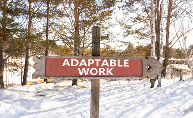 Adaptable work symbol. Concept words Adaptable work on beautiful wooden road sign. Beautiful winter forest snow tree background. Business Adaptable work concept. Copy space.