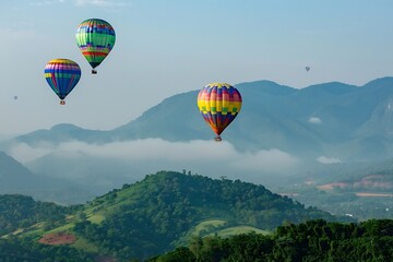 Naklejka premium Hot air balloons flying over the mountains at sunrise, Chiang Mai, Thailand