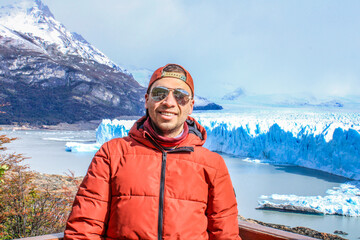 Tourists enjoying the views of the Perito Moreno Glacier, a giant glacier at the end of the world,...