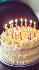 Delicious birthday cake with lit candles celebrating a special occasion