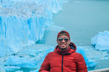 Tourists enjoying the views of the Perito Moreno Glacier, a giant glacier at the end of the world,...