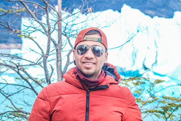 Tourists enjoying the views of the Perito Moreno Glacier, a giant glacier at the end of the world,...