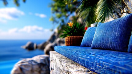 Obraz premium A blue couch sitting on top of a stone wall next to the ocean