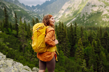 A young traveler travels along mountain paths. Hiking. Adventure, travel concept.