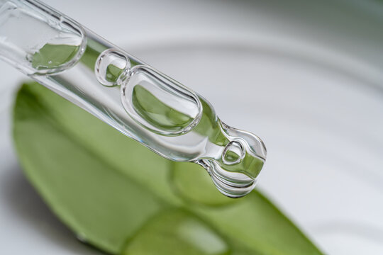 Aloe vera leaf with dropper showcasing natural skincare essence