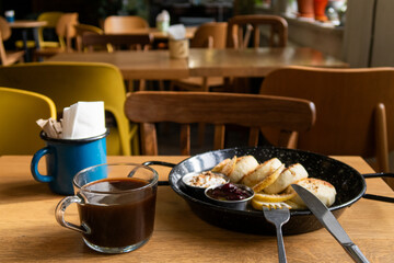 delicious cheesecakes with sour cream and berry jam and coffee