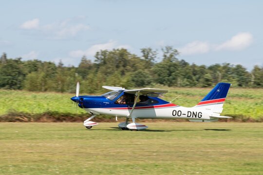 24 august 2024. A light airplane with propeller, type Tecnam P2010 P TwentyTen during take off at Kiewit regional airport. Open house at aero kiewit. Propeller airplane with number 00-DNG.