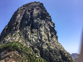 Majestic rock formation under clear blue sky