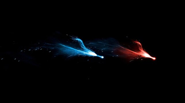 A pair of small, synchronized fireworks in red and blue, bursting quietly in the deep black night