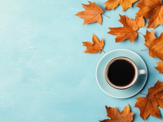 A Cozy Autumn Coffee Scene with a Cup of Black Coffee Surrounded by Vibrant Orange and Brown Maple Leaves on a Light Blue Background
