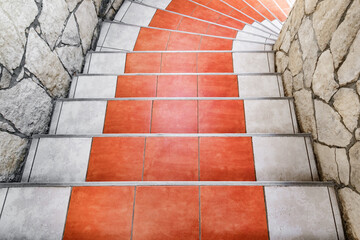 tiled staircase between stone walls, top view