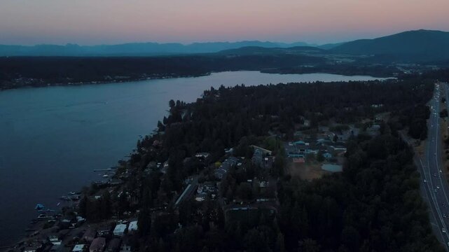 Aerial landscape of Lake Washington forest and mountains at sunset Bellevue suburb of Seattle WA