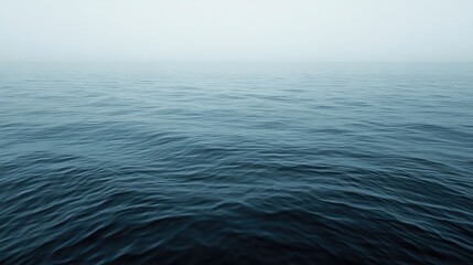 Obraz premium Calm, misty ocean surface.