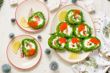 Spinach roll with cream cheese, salmon and red caviar