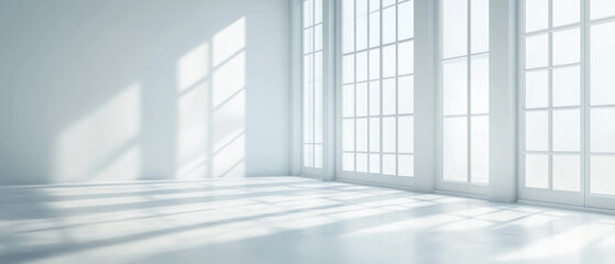 image.png
O
An expansive white room features multiple large windows casting dramatic geometric shadows across the pristine floor and walls in soft natural daylight. Generative AI.