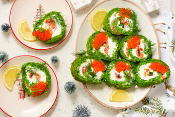 Spinach roll with cream cheese, salmon and red caviar