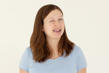 Fototapeta premium Portrait of attractive flirty cheerful girl winking good mood isolated over white background