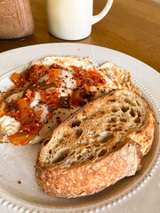 Breakfast plate with eggs and kimchi, and sourdough toast