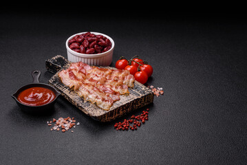 Bacon sliced, grilled with salt and spices