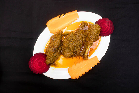 duck curry with carrot served in tray dish isolated on wooden table side view of bangladeshi food