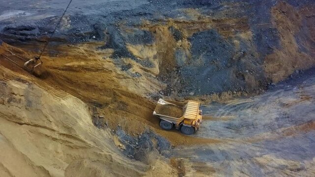 An Aerial View Capturing Heavy Mining Equipment Actively Engaged in Various Operations. Stock Clip