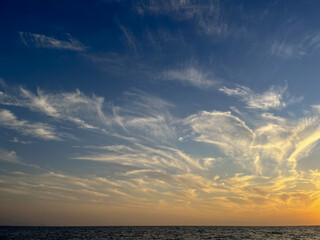 the sea wave rolls over the colorful pebbles on the Black Sea coast