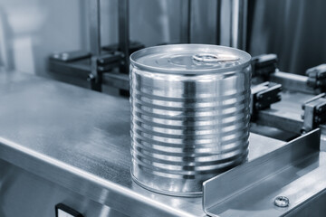 Metal can for canning in a food factory, on a metal packaging conveyor