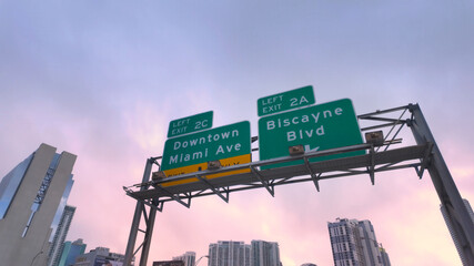 Obraz premium Downtown Miami directional signs on the highway - MIAMI, UNITED STATES - NOVEMBER 5, 2024