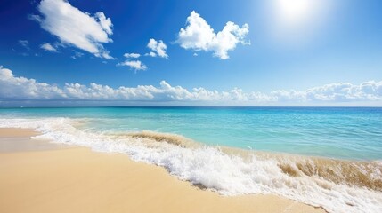 Obraz premium Serene Beach with Waves Under a Bright Blue Sky