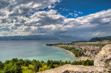 Castle walls, view of Samuil's Fortress, Unesco World Heritage Site, on Lake Ohrid, Ohrid town. View from watchtower of famous old fortress ruins of king Samuel. Clouds over the Lake and blue water.