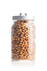 Roasted salted corn snack in jar isolated on white background.