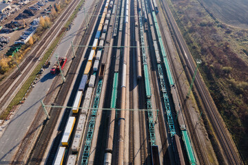 Aerial view of cargo trains in a freight yard
