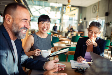 Business meeting at cafe with diverse team