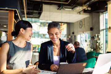 Business meeting at cafe with diverse team
