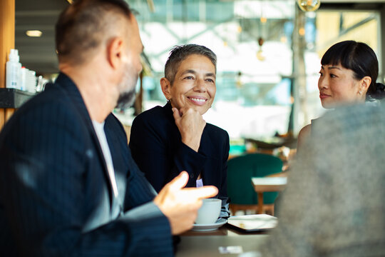 Business meeting at cafe with diverse team