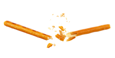 Broken salty cracker pretzel sticks stuffed with peanuts and crumbs isolated on white