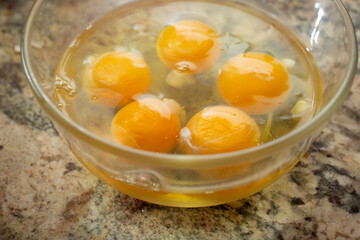 A closeup view of a bowl of eggs.