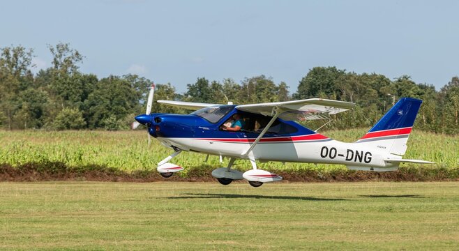 24 august 2024. A light airplane with propeller, type Tecnam P2010 P TwentyTen during take off at Kiewit regional airport. Open house at aero kiewit. Propeller airplane with number 00-DNG.