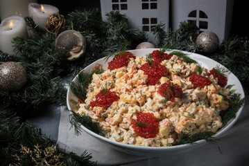 Olivier salad in New Year's holiday decor, side view.