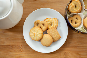 A top down view of a plate of Danish butter cookies.