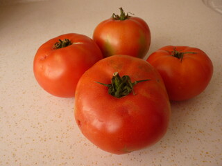 The Essence of Simplicity: A Cluster of Ripe Tomatoes Representing Nature's Abundance and the Cycle of Growth and Nourishment